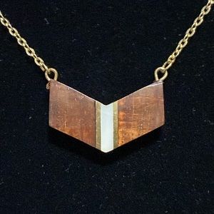 Wood with white/mother of pearl and gold-tone inlay necklace.